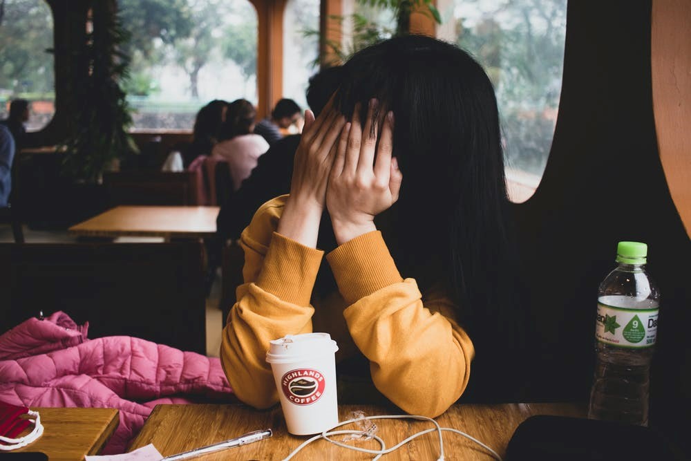 Women covering her face